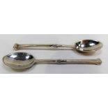 Two Arts & Crafts silver spoons by Omar Ramsden, both stems with central twist and nail head finial,