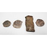 Four silver 'cob' coins, possibly Reales, one of oblong shaped form