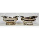 Pair of George III Irish silver oval salts with gadrooned rims and on pedestal gadrooned base, maker