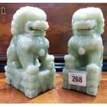 Pair of Chinese green mottled jadeite carved Buddhistic lions, height 6in.