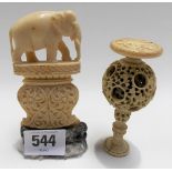 19th Century Indian carved ivory model of an elephant upon vase shaped foliate carved base, height