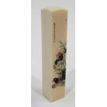 Japanese Meiji period rectangular section ivory desk seal engraved and stained in green, red and