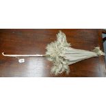 19th Century lady's parasol with carved ivory handle and grey silk canopy with tassels, length