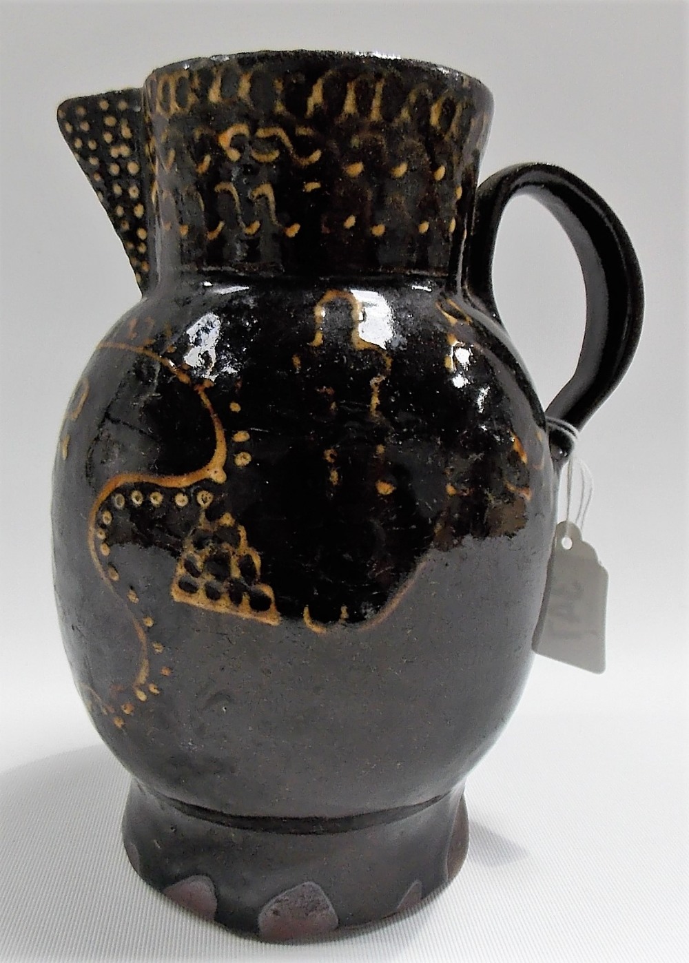 Rare early 19th Century slipware ovoid jug, monogrammed J & S and dated 1813 within a shaped