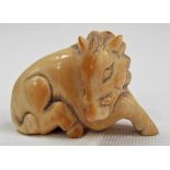 19th Century Japanese ivory Netsuke carved as a reclining boar, width 2in.