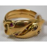 18ct gold snake twist ring, the twin heads set with diamond and ruby eyes, stamped 18, weight 10.