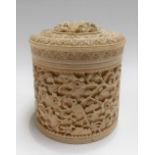 19th Century Chinese Export ivory cylindrical box with threaded lid, profusely carved with foliage