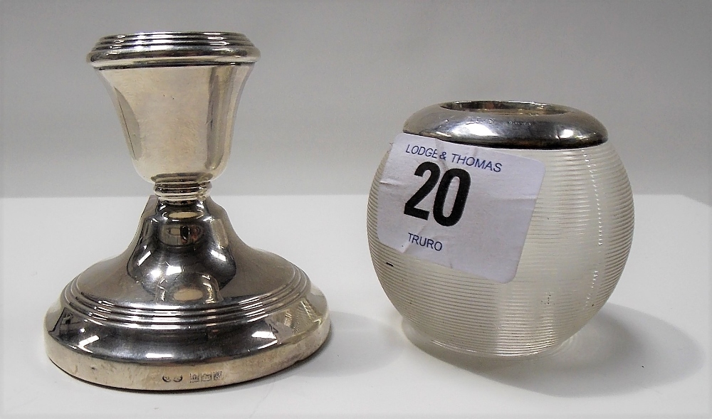 Silver mounted glass ovoid match strike, London 1911; together with a squat silver candlestick,