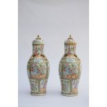 A pair of lidded Canton vases with gilded decor (*) (66cm)