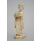 A Japanese ivory geisha with fruitbasket, mark (17cm)