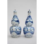 Pair of bottle vases in Chinese blue and white porcelain 'landscapes', marked (27cm)