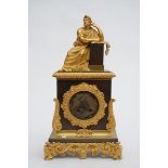 A Charles X clock in gilt bronze 'Greek figure' (12x23x42cm)