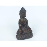 A Tibetan cast metal seated Buddha
