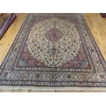 A fine signed northeast Persian Mashad carpet 380x290cm