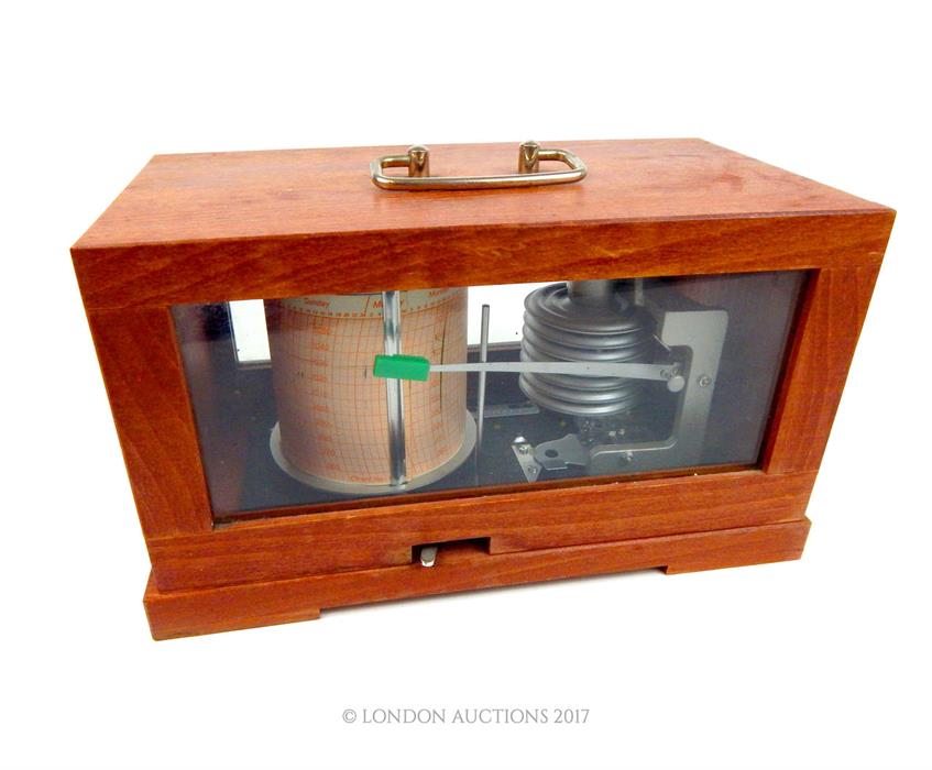 A barograph in a glazed case