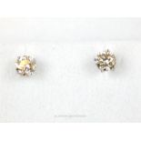 A boxed pair of 18 ct white gold studs (83 points)