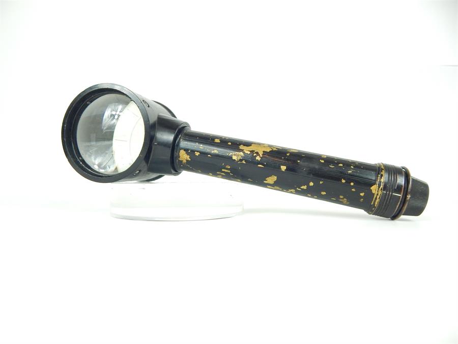 A vintage military style black painted magnifying glass