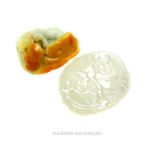 A Chinese carved jade pendant with another carved item (2)