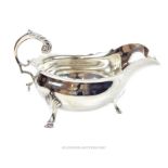 A late Victorian sterling silver sauce boat