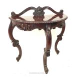 A mahogany, Rococo-style, carved side table