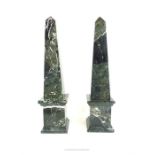 A pair of polished, black and white veined marble obelisks