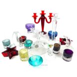An array of colourful glass wares including: a candelabra and figurine.