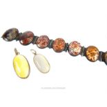 An Agate bracelet together with two white metal mounted oval agate pendants