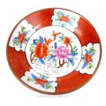 A Chinese porcelain dish decorated in the famille rose palette