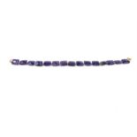 A 9 ct yellow gold and cushion-cut, amethyst bracelet