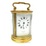 MALLET OF BATH A 20th CENTURY GILT BRASS CYLINDRICAL CARRIAGE CLOCK, having four bevelled glass