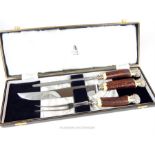 A cased, Mappin & Webb 3 piece serving set with horn and white metal finials