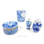 Four oriental blue and white ceramics:ginger jar (damaged lid); brush pot, small vase and a large