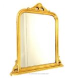 A large, gilt, over-mantel mirror