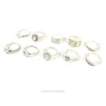 A collection of ten ladies sterling silver rings set with white stones