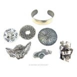 A collection of pewter jewellery items
