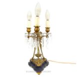 A 19th century, French, gilt metal, 3 branch table light with crystal drops