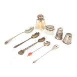 A collection of silver items including jars, spoons and cruets