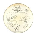 A vintage 'Remo' drum head signed by Status Quo, dated 1997