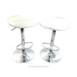 A pair of chrome adjustable stools