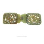 A Chinese carved jade belt buckle