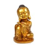 A gilt bronzed Buddha figure
