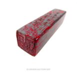 A Chinese chicken blood seal stone; 9.5 cm long