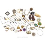 A collection of items including costume jewellery, a pair of spectacles, a silver blotter and