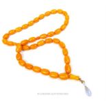 A string of bakelite amber coloured Islamic prayer beads