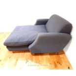 A large, contemporary day bed in grey upholstery