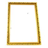A large, rectangular wall mirror with a decorative, moulded gilt frame