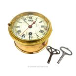 A brass cased ship's clock