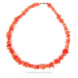 A vintage coral necklace composed of rough coral beads