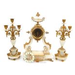 A gilt metal and alabaster clock garniture