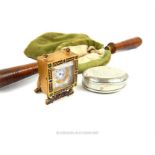 A French gilded and enamelled miniature clock with other items